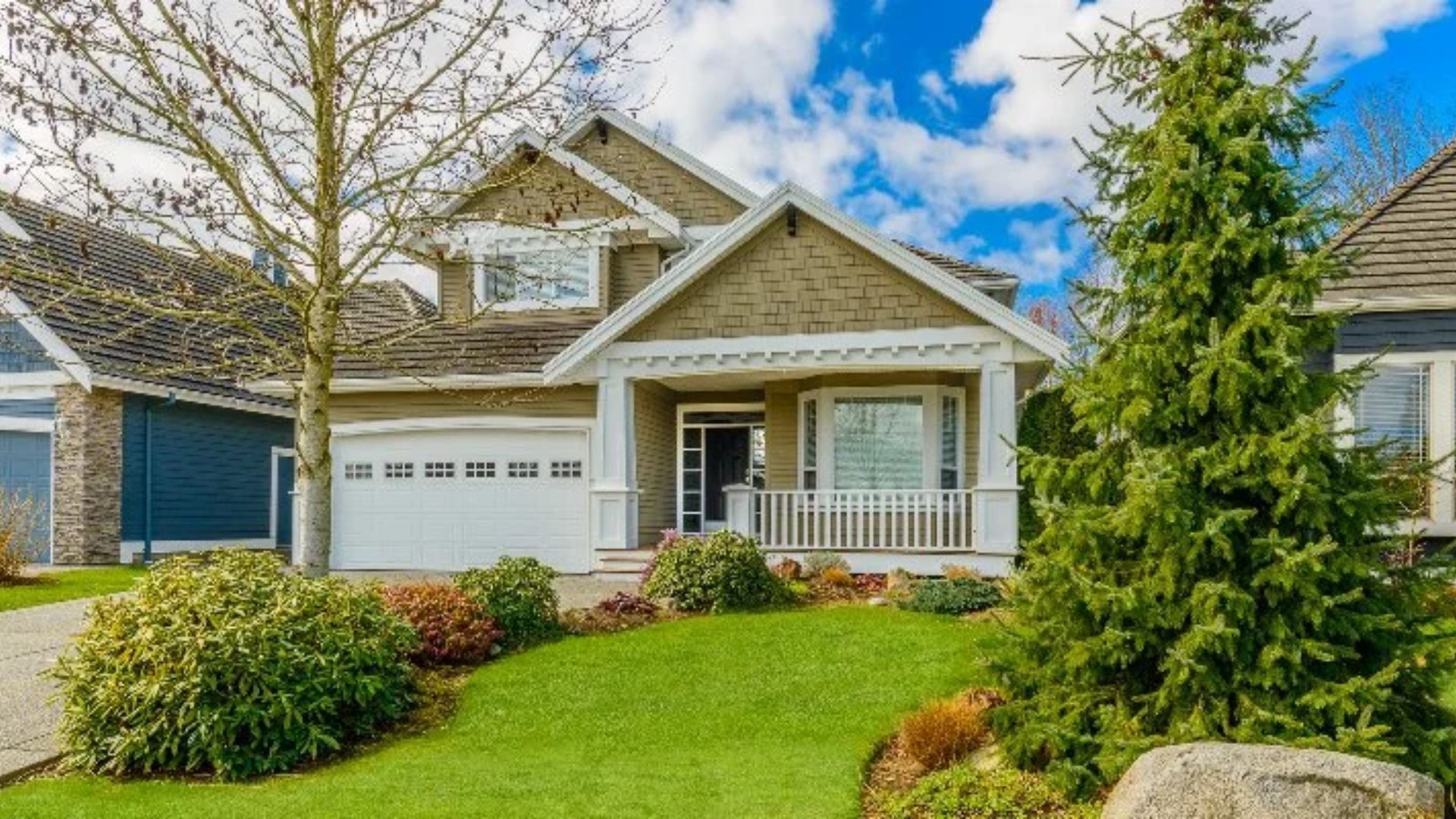 A charming home surrounded by a well-maintained yard and attractive landscaping.