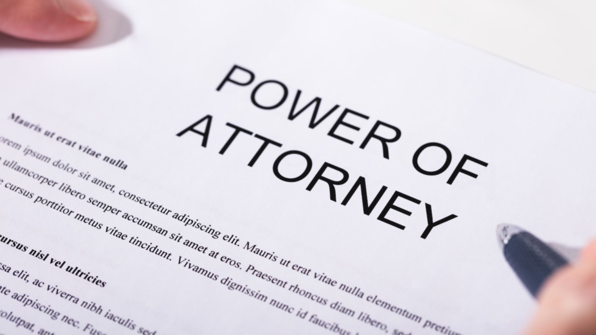 Document titled "Power of Attorney" with legal text and signature lines, symbolizing authority and decision-making.