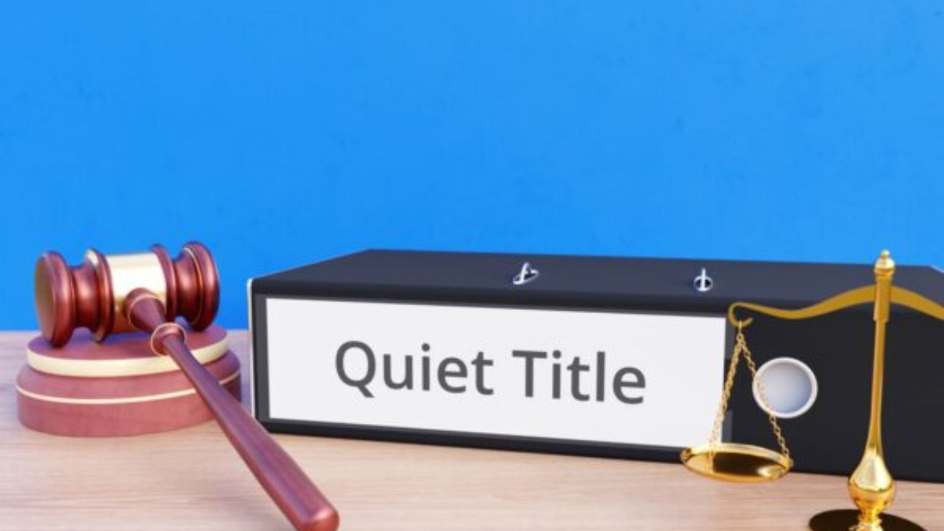 Quiet title text in a box alongside a gavel and scales, symbolizing legal authority and balance in property disputes.