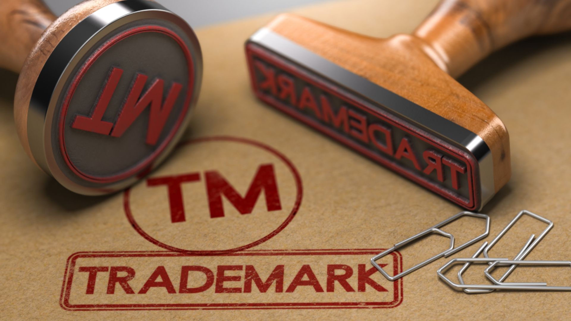 Trademark stamp impression on paper, created with a rubber stamp, showcasing a formal branding mark.