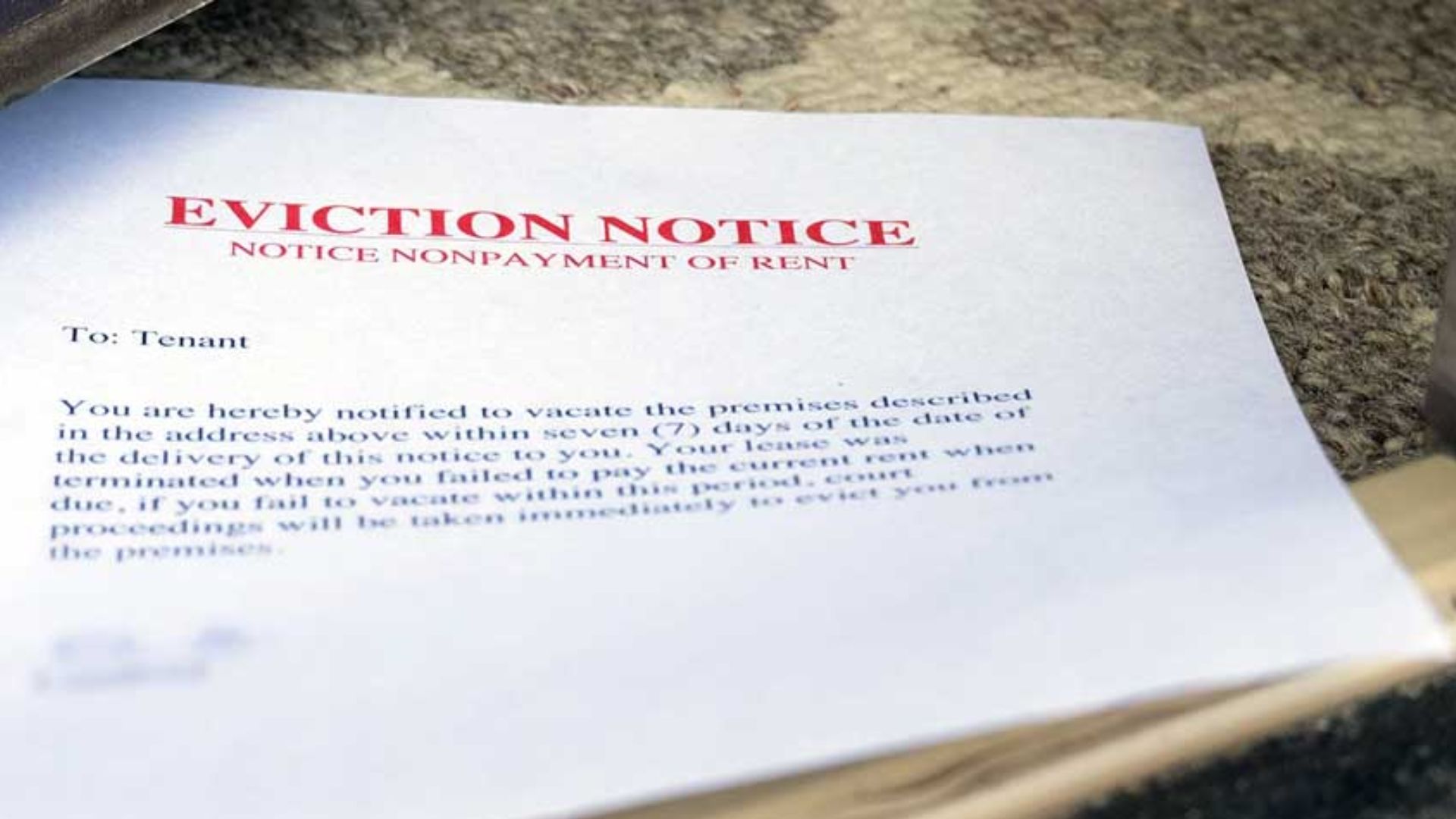 Eviction notice printed on a white piece of paper, detailing the tenant's required move-out date and legal information.