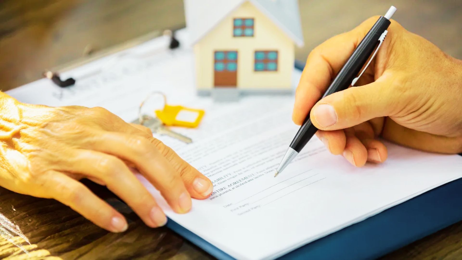 A real estate agent and a client signing a contract, discussing property trust options.