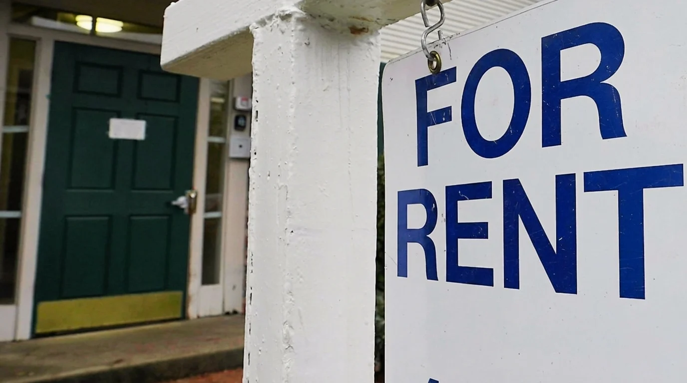 A for rent sign outside a home in New York, indicating available rental property.