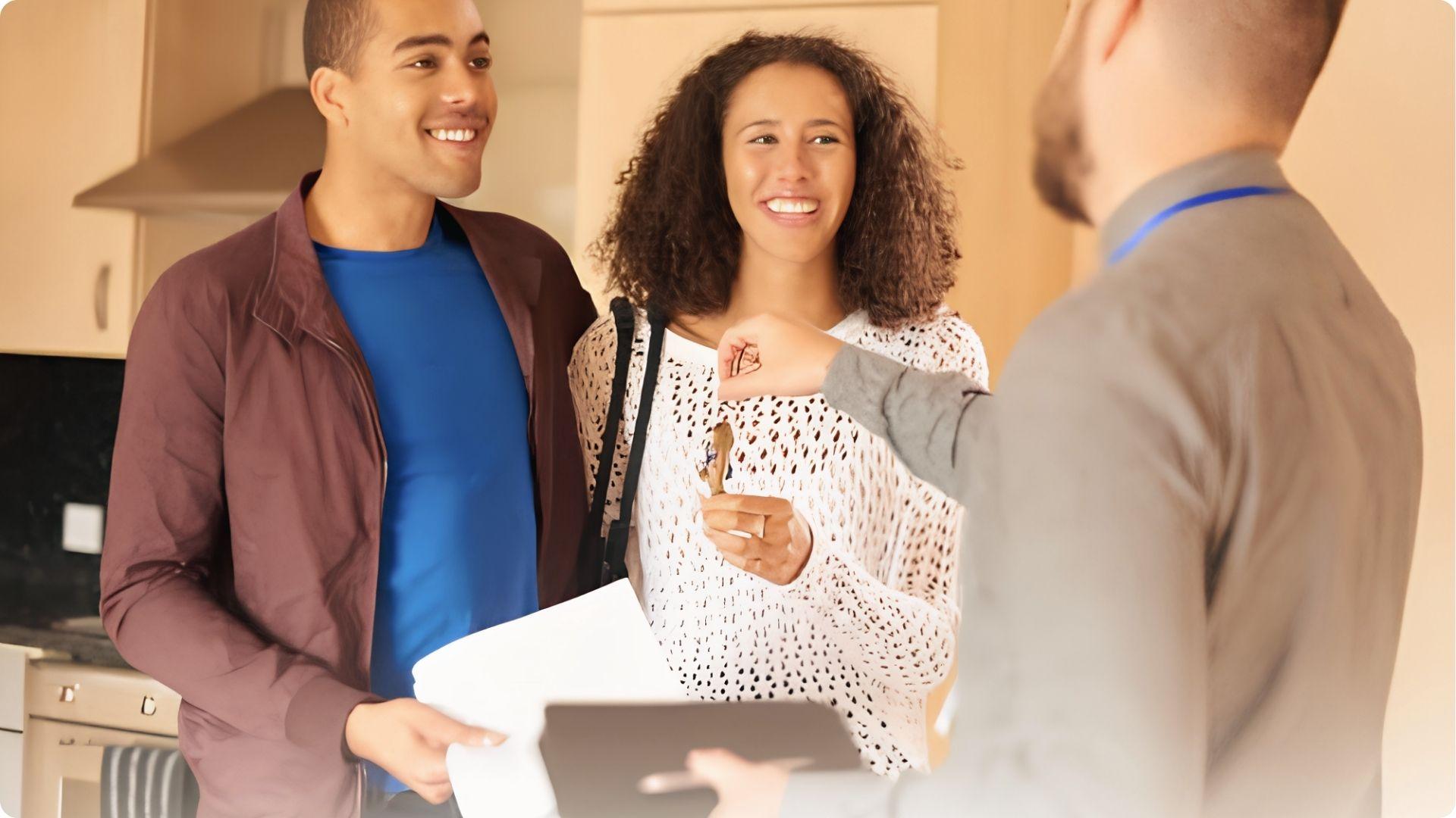 Couple receiving house keys from agent facing unclear tenants in common ownership rights dispute