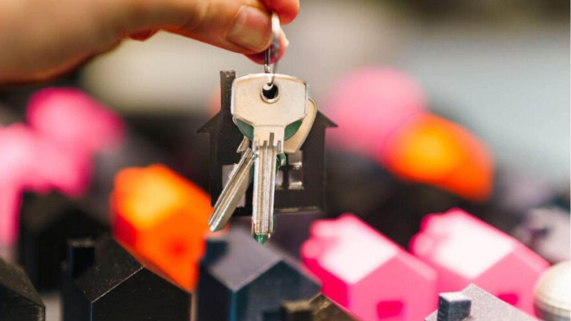 A man holding keys to his new property