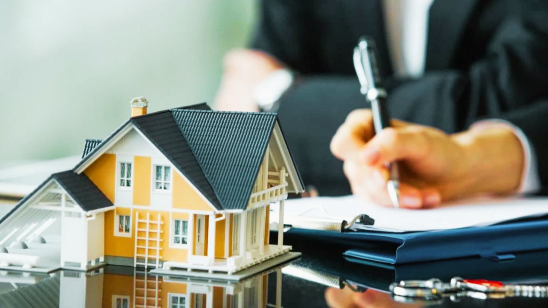 A man completing paperwork for the process of obtaining a reverse mortgage for manufactured homes.