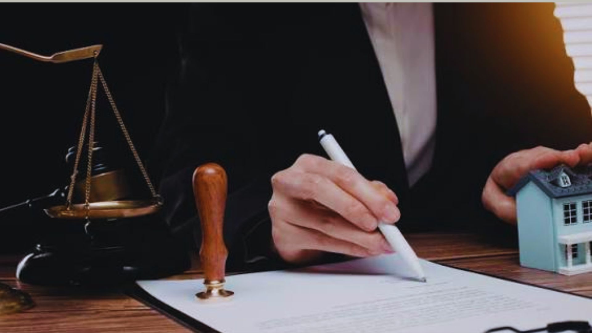 A person reviewing documents with a real estate agent discussing warranty deed use in a home purchase.