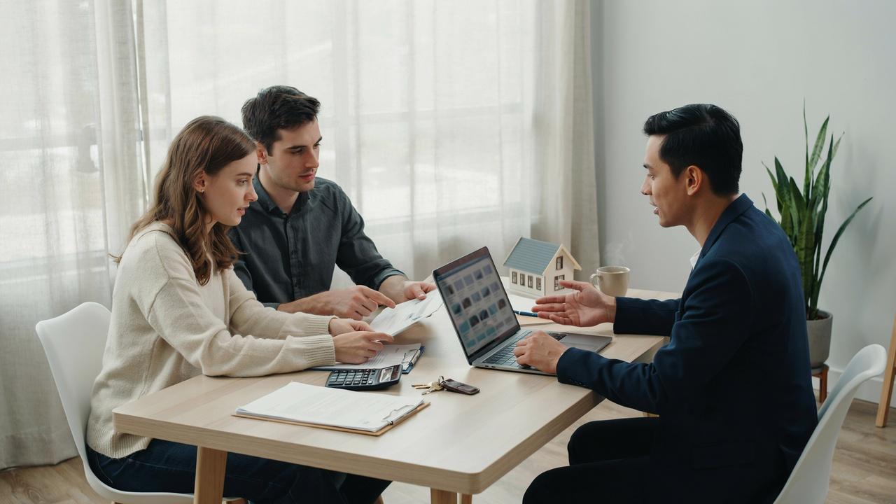 Homebuyer reviewing property records and deed documents before purchasing a home.