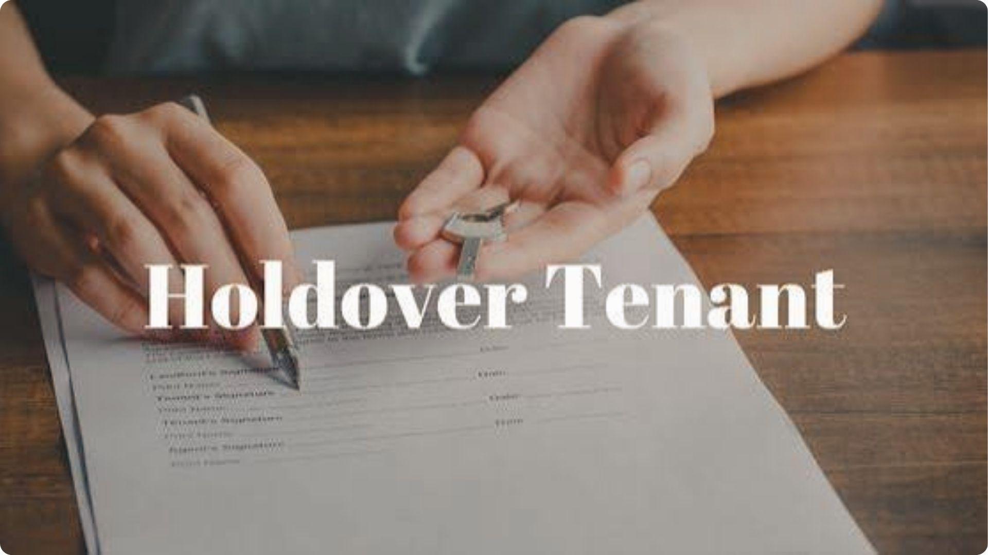 Hands signing lease papers holding house keys with Holdover Tenant text on wooden table background