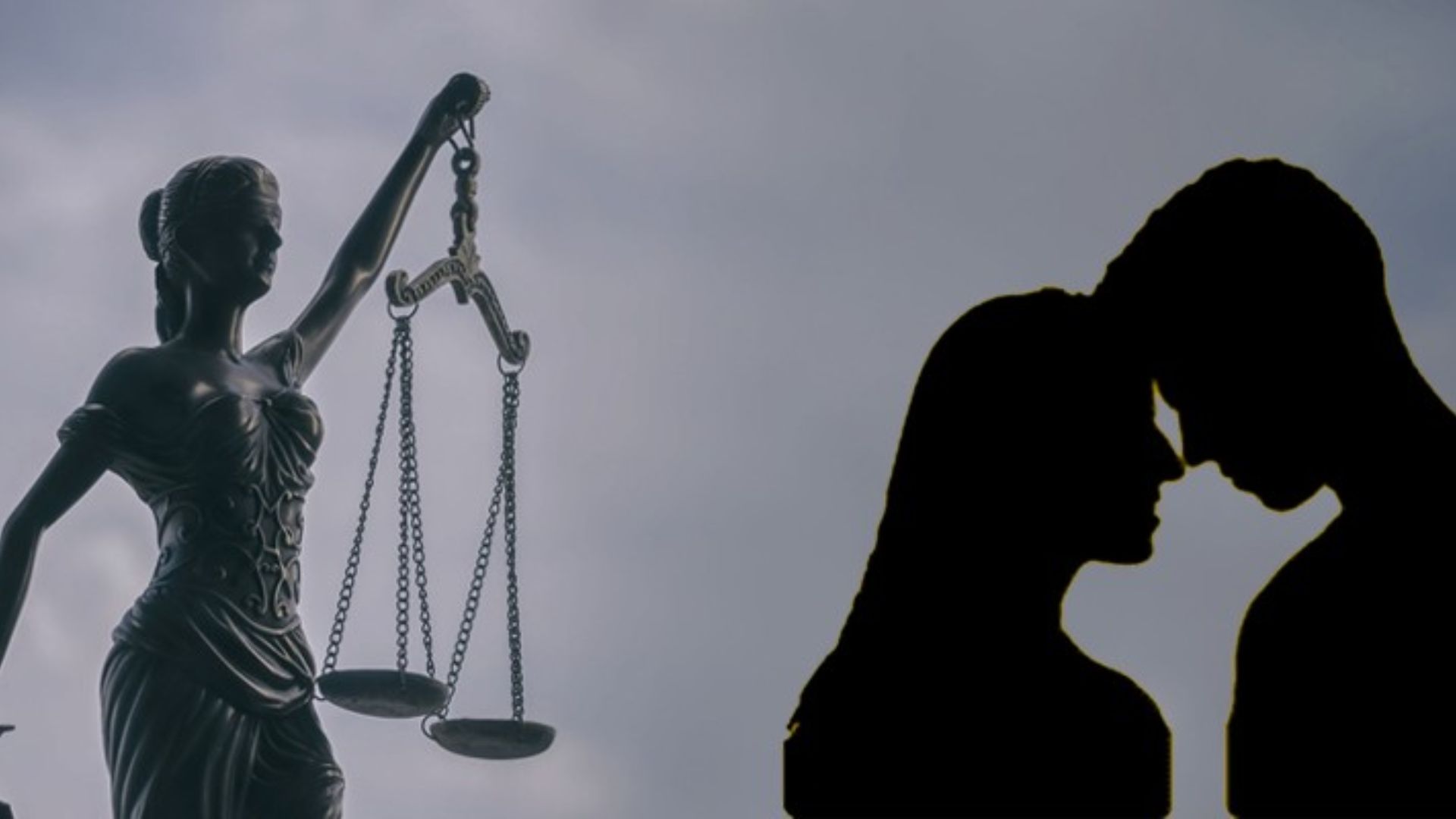 A couple in front of a justice statue, representing the differences between domestic partnerships and cohabitation.