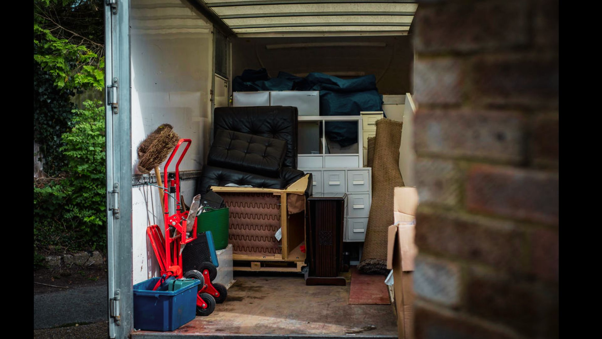 Household furniture and boxes inside a home awaiting probate.