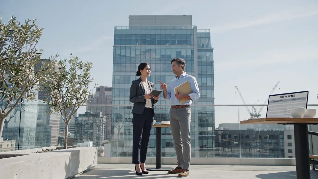 Business owners comparing buying and leasing commercial property options.