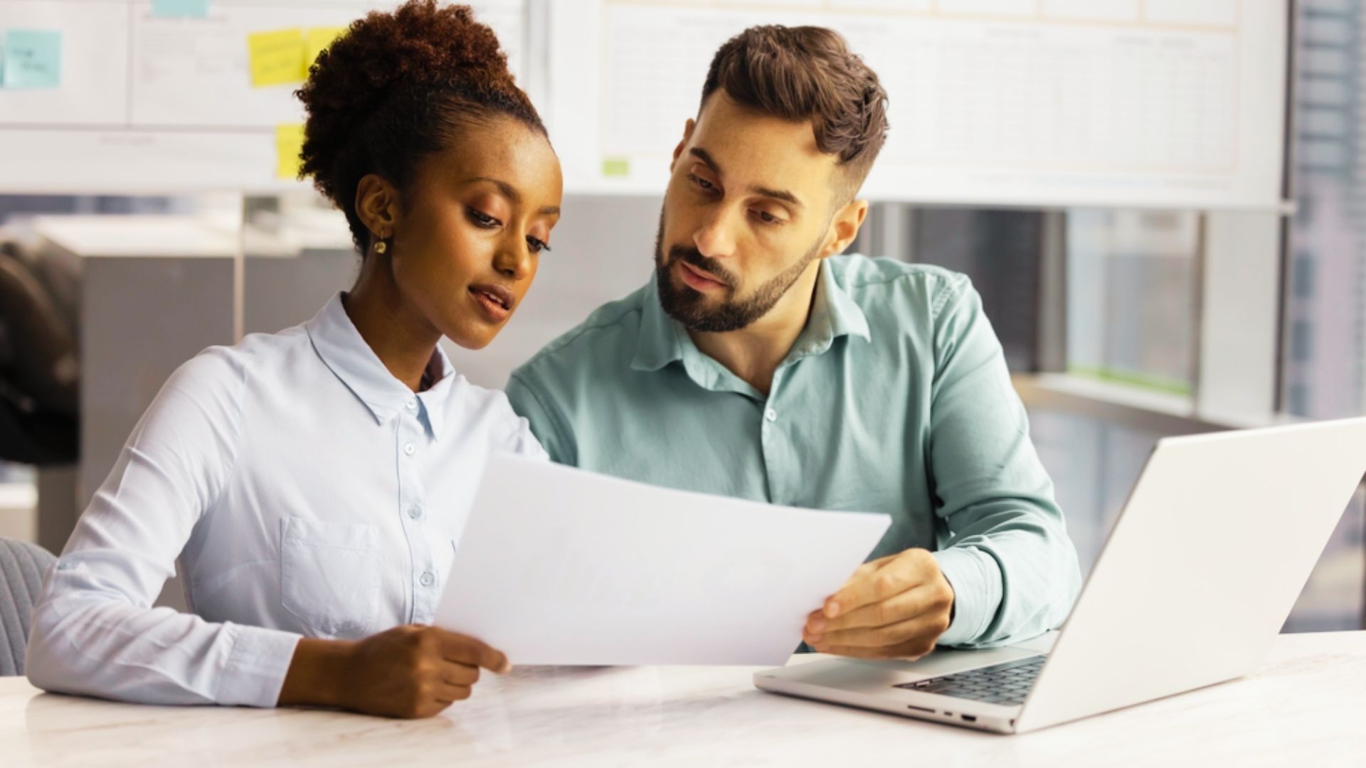 a man and a woman discussing the name removal from the deed.
