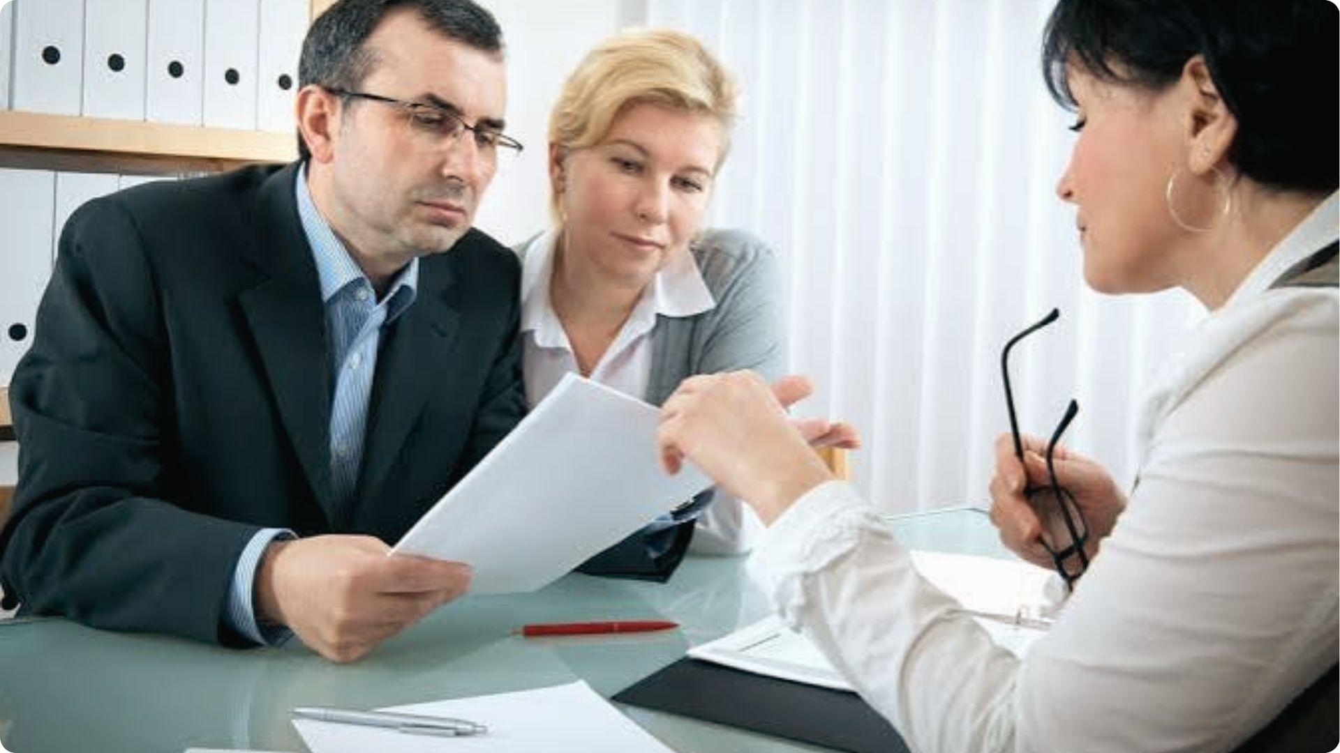 The Executor cannot act as a biased legal advisor while a couple reviews estate documents in office.