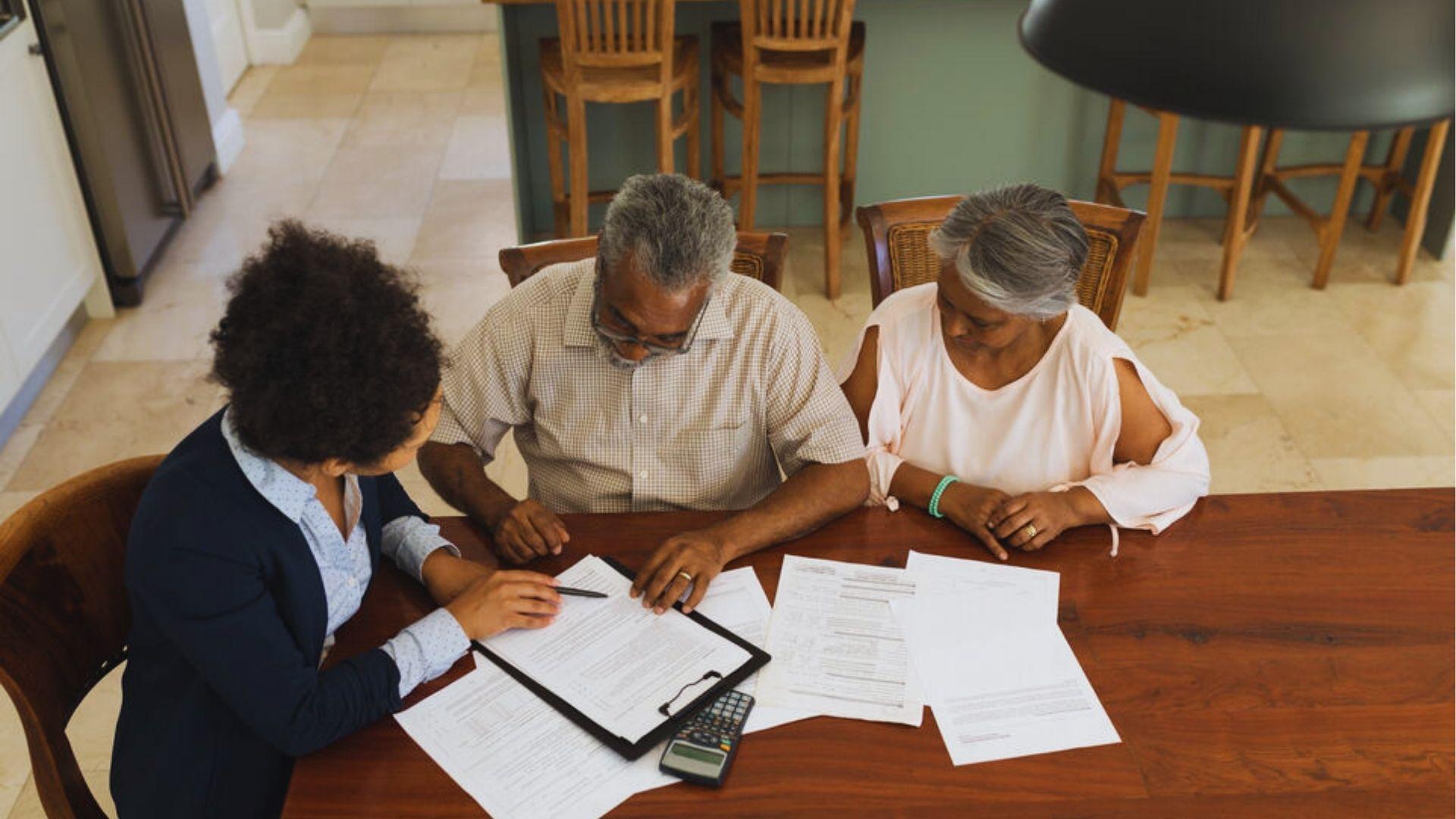 An old couple discussing formalities with with their agent