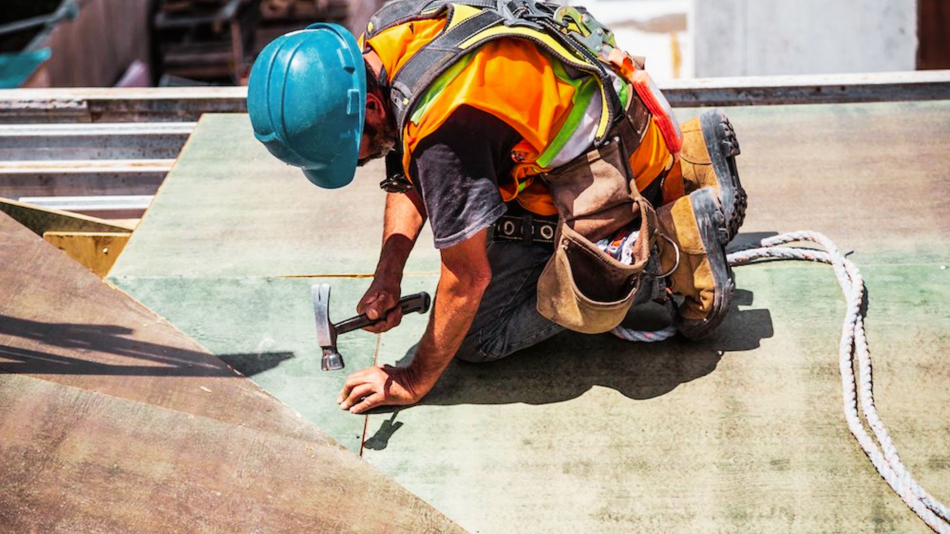 Construction worker inspecting structural defects during a building repair.