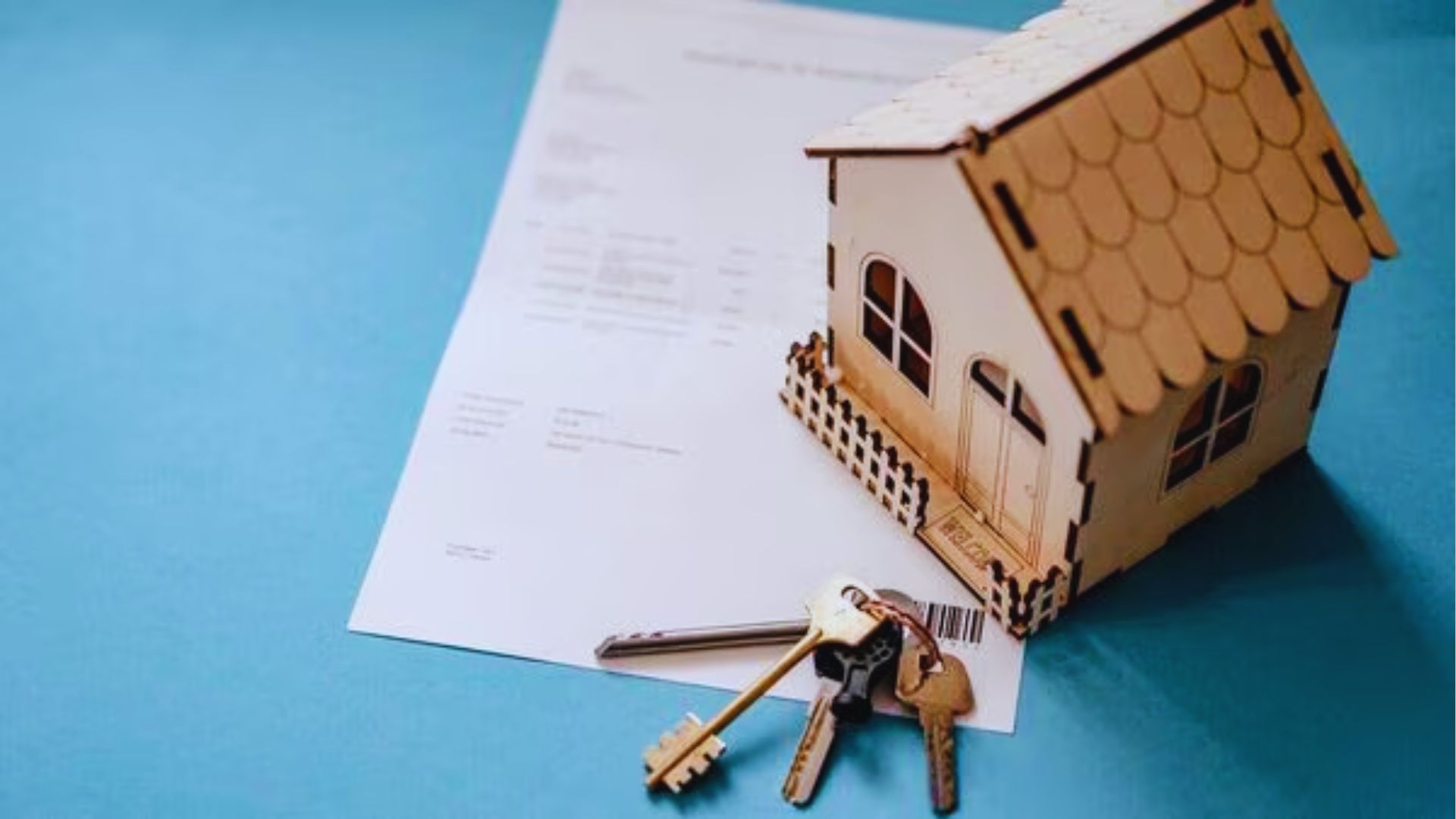 A homebuyer examining a house model while wearing a mask, symbolizing real estate during the pandemic.