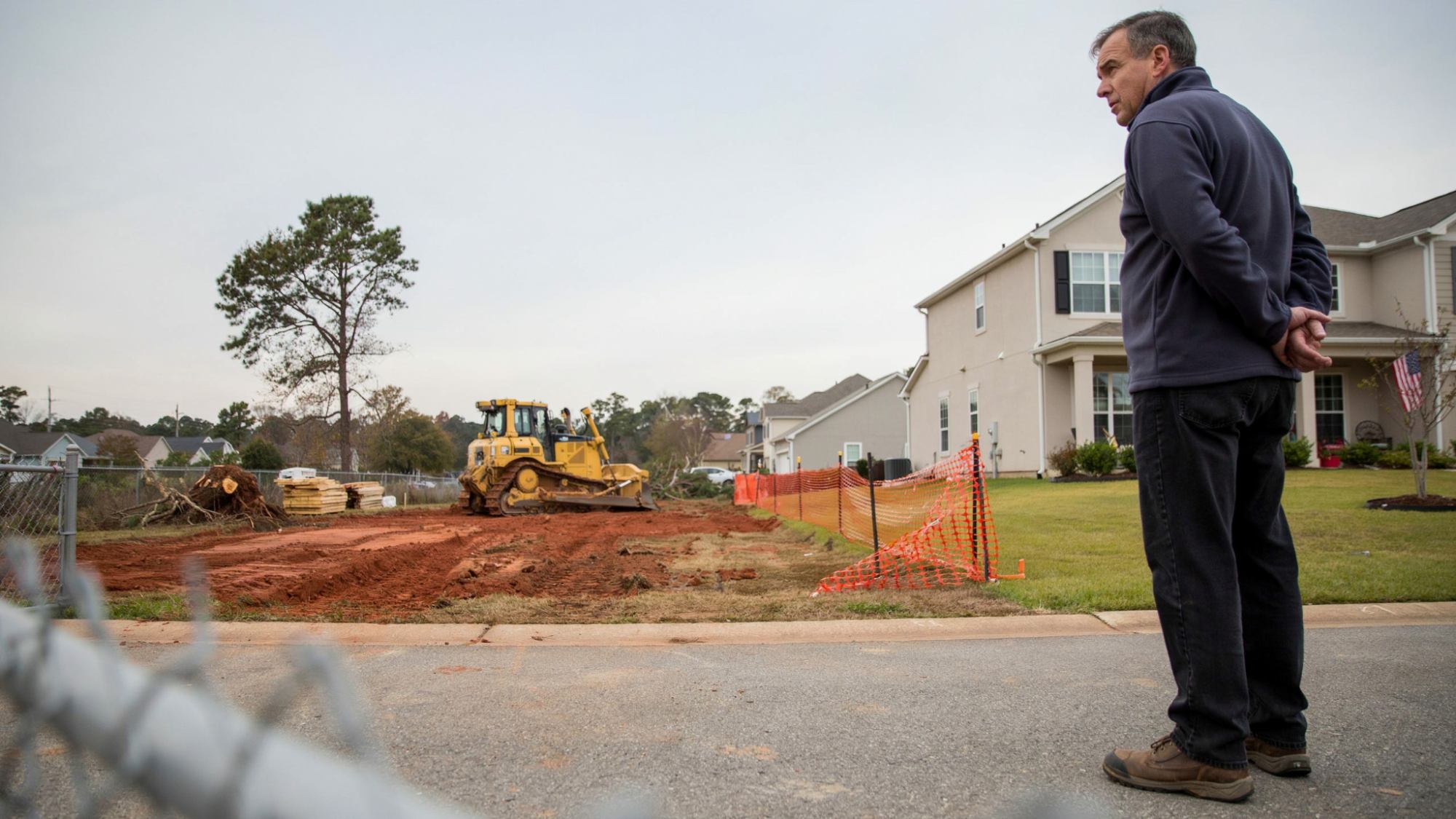 Homeowner viewing nearby development that may affect property use and rights