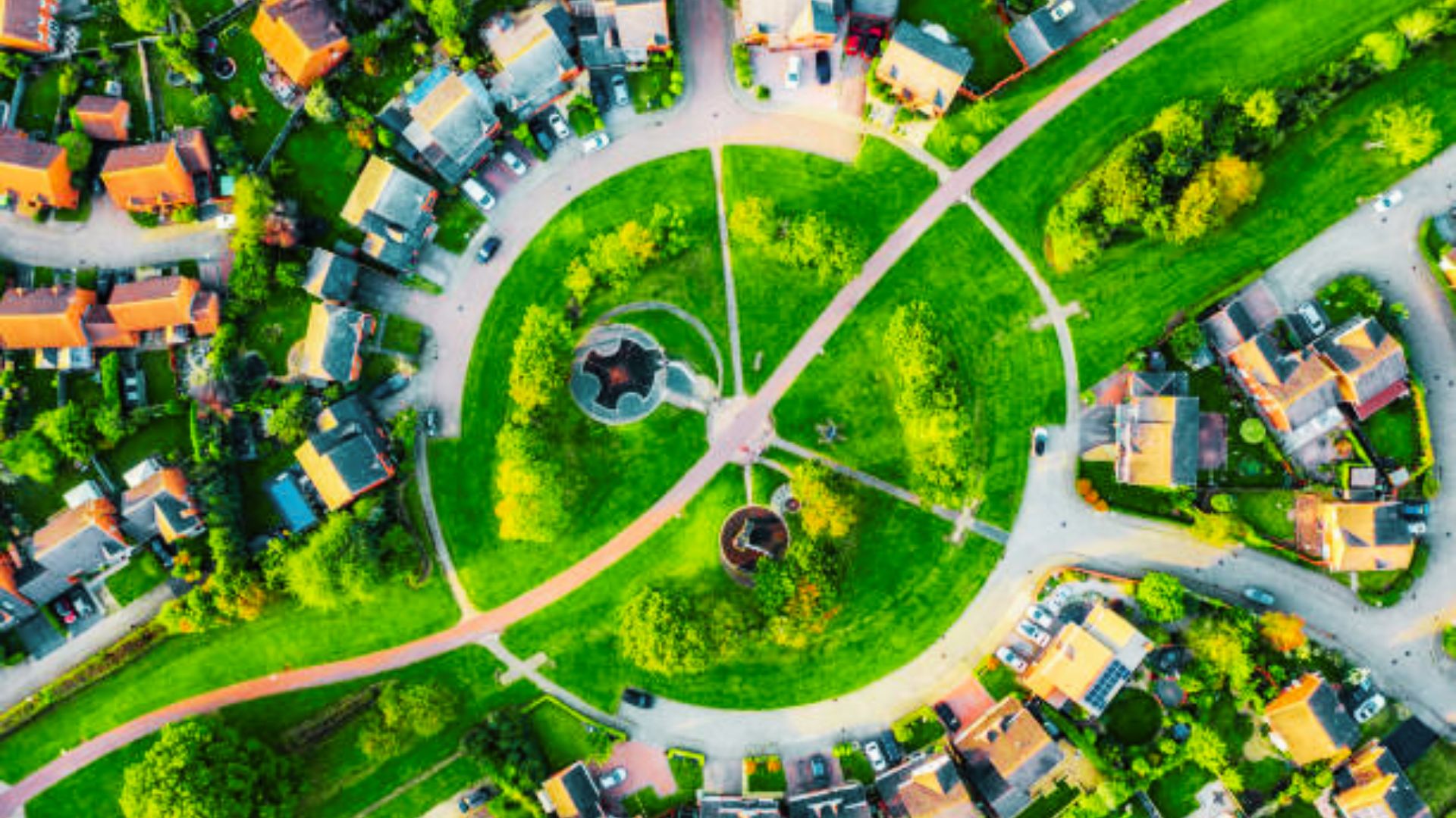 Aerial view of a suburban neighborhood showcasing houses and trees, illustrating community property trust considerations.