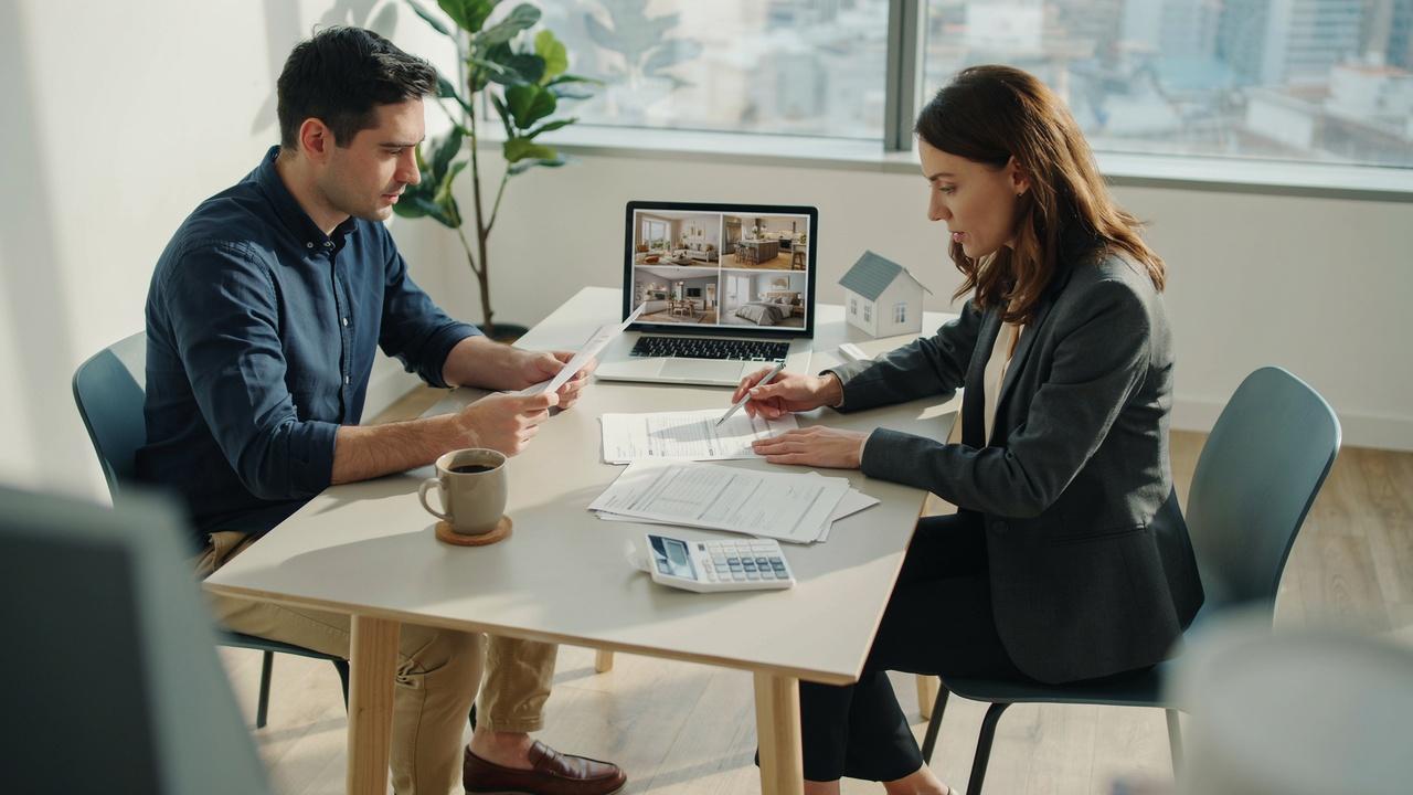 Person reviewing financial documents, savings, and mortgage paperwork before applying for a home loan after bankruptcy.