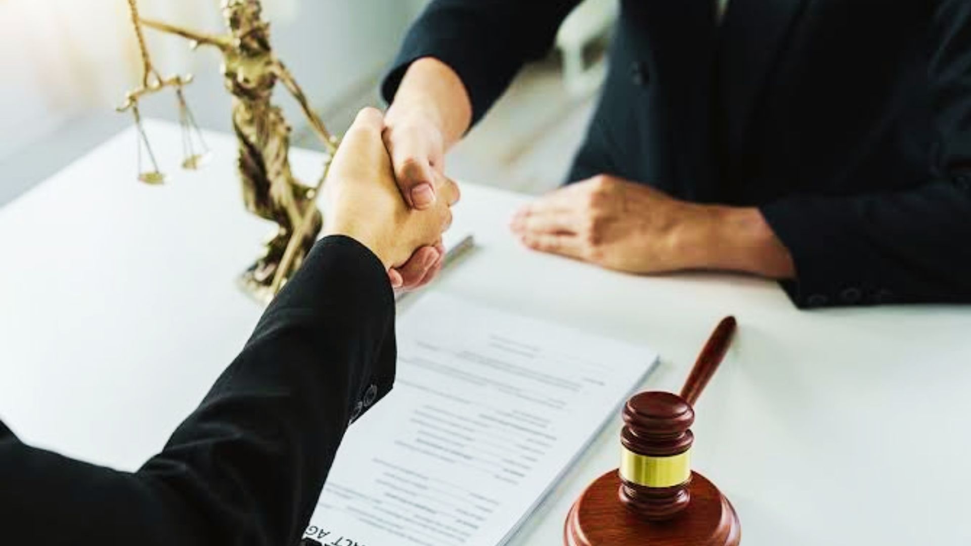 a person shaking hands with a lawyer and discussing the defect law.