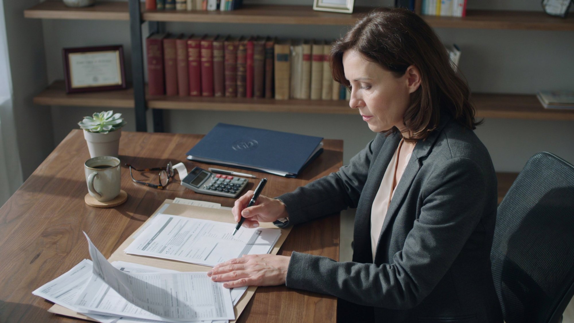 Executor reviewing estate account paperwork and financial documents