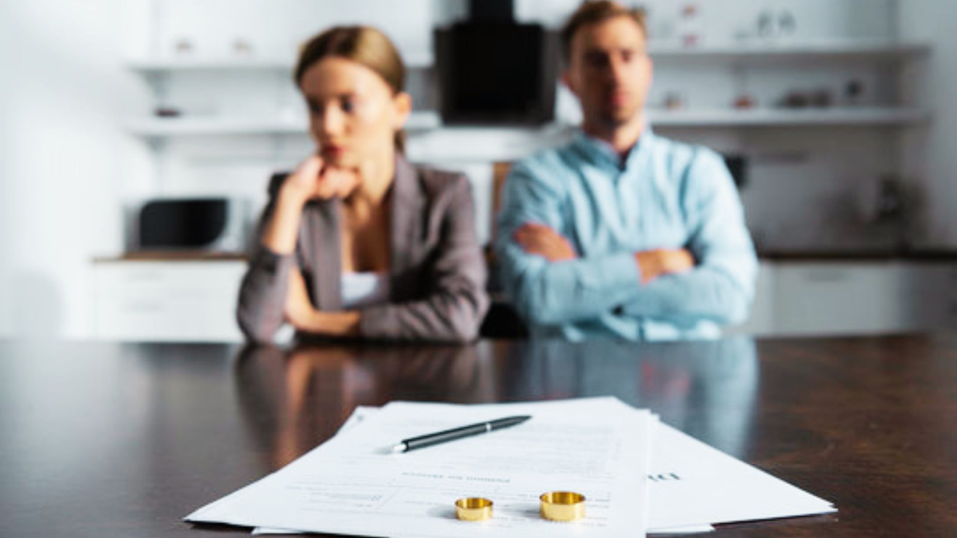image showing a couple getting divorced and having shared property papers.