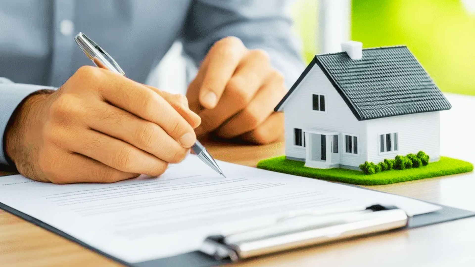A man reviewing the deed papers of a mortgage house.