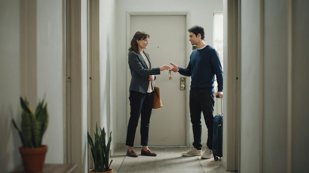 Landlord and tenant exchanging keys, showing how their actions can end a lease without a signed termination letter. File name: keys-empty-apartment-lease