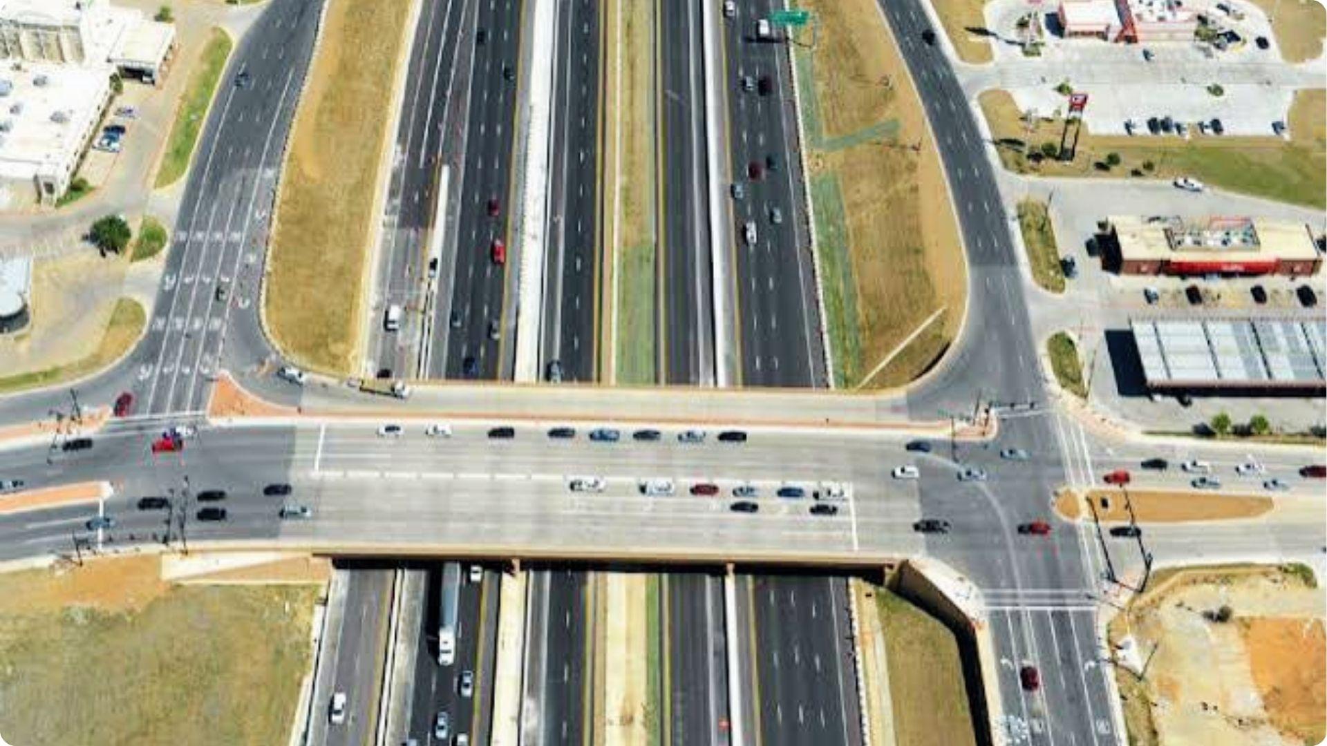 Aerial view of highway overpass and traffic showing public right of way for roads and transport