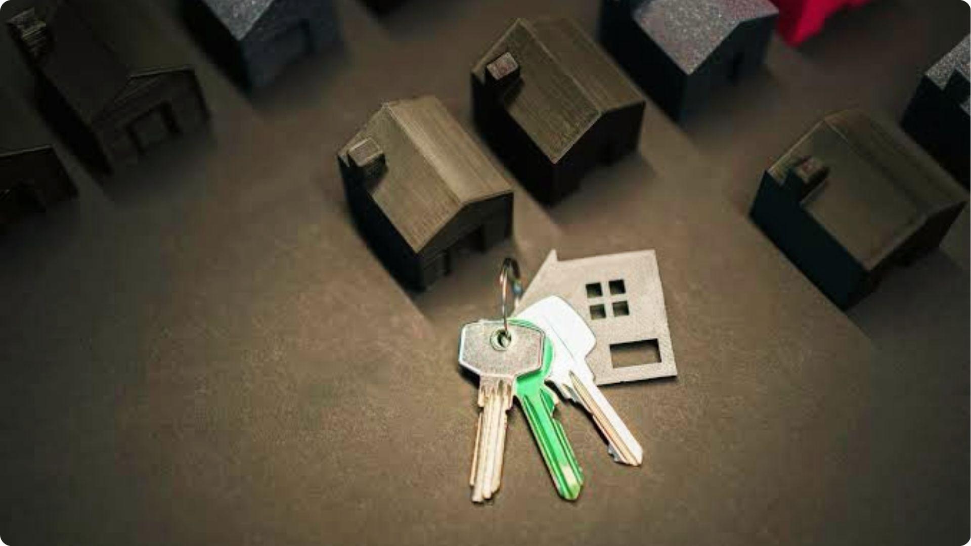 Model houses with keys and house-shaped cutout symbolize property access in easement vs right of way