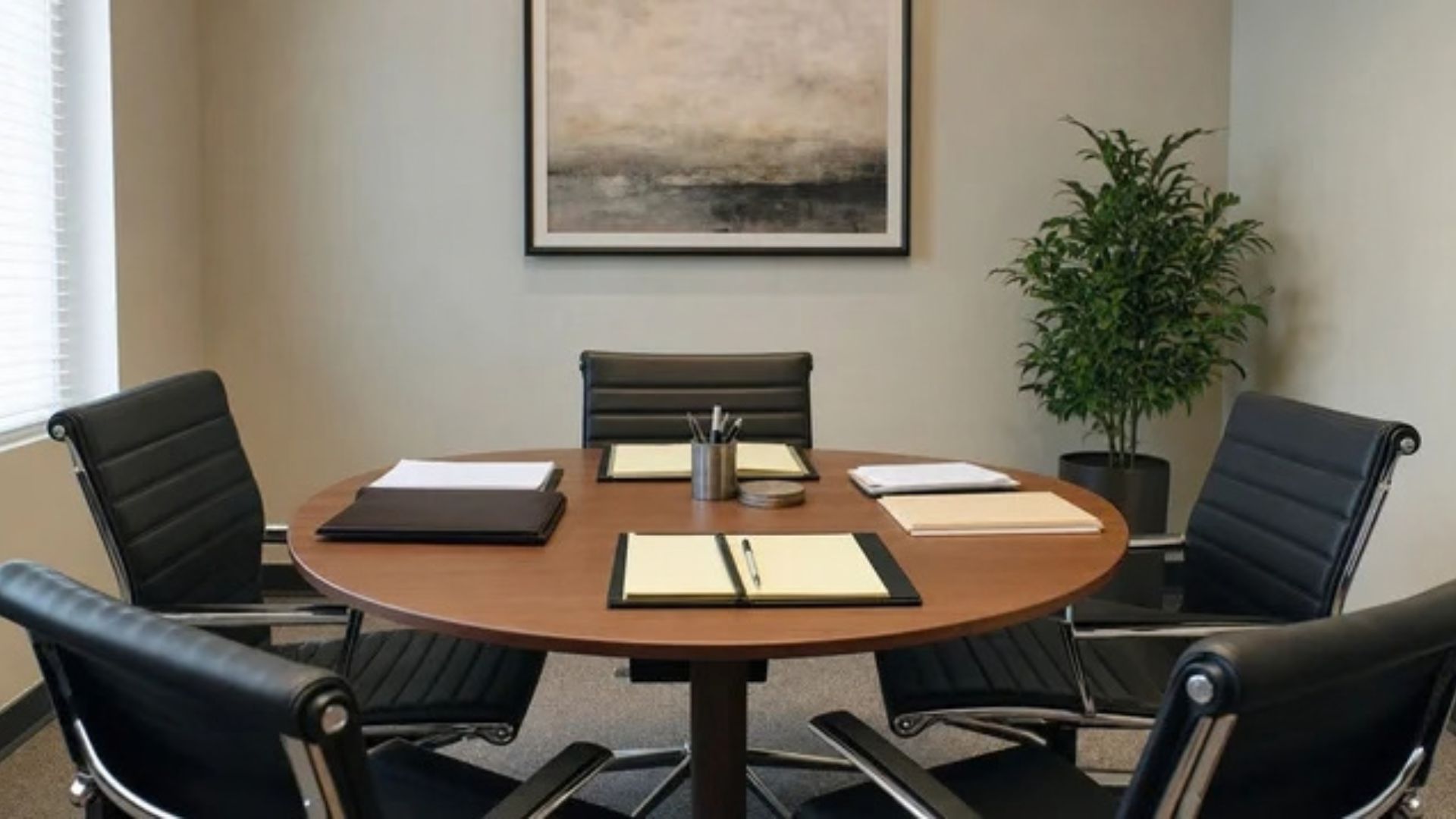 Empty negotiation table set with folders and documents